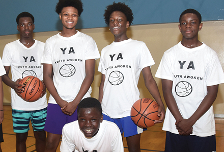 boys from Youth Awoken in the gym playing basketball